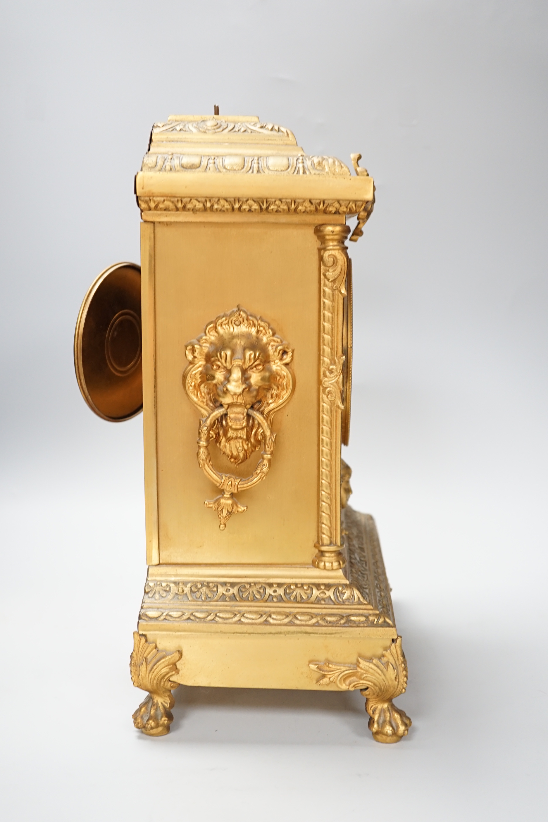 A 19th century French brass mantel clock- no pendulum, loose finial, 37cm excl finial